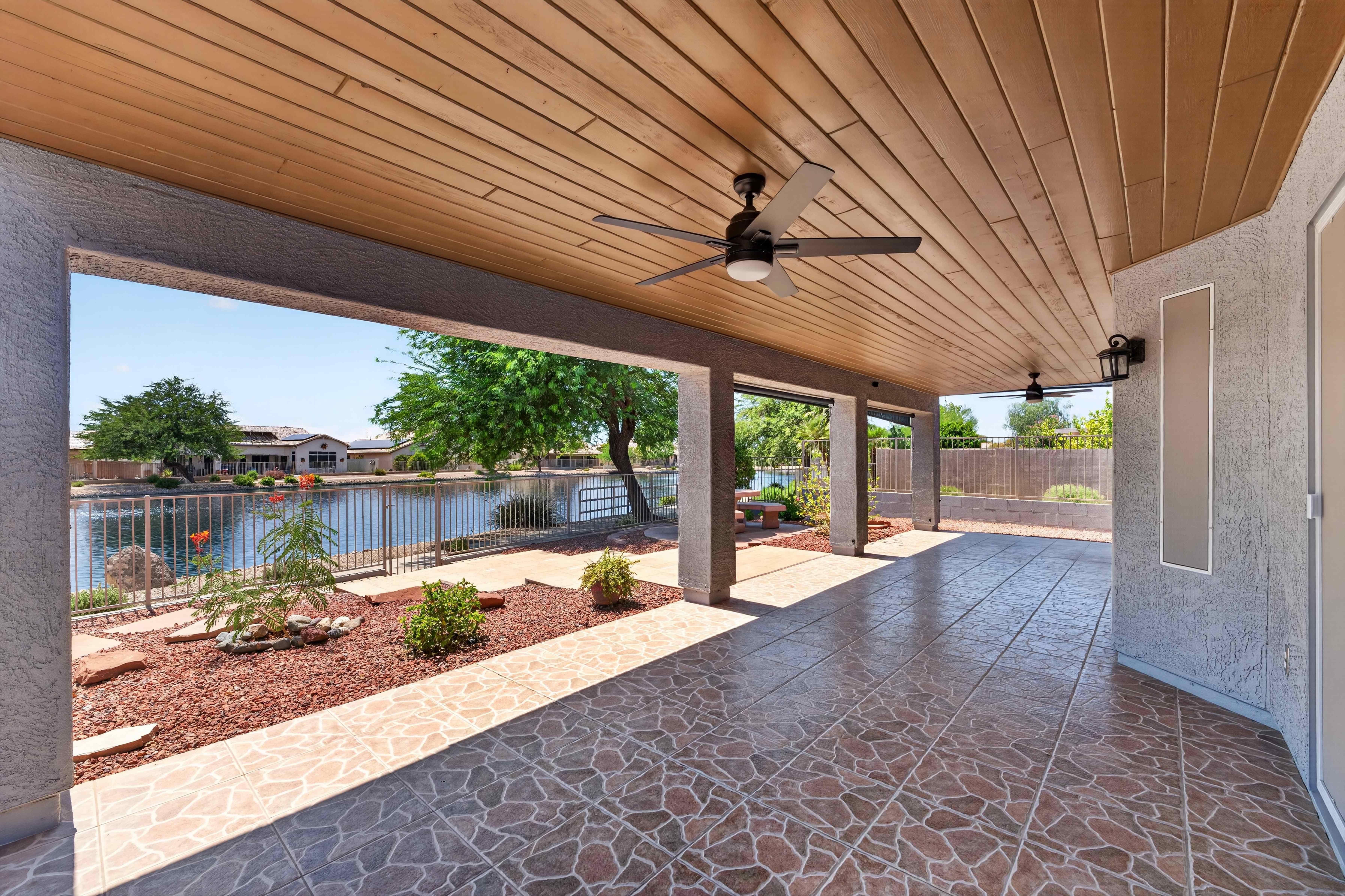 Lakeside covered patio photographed in flat midday daylight
